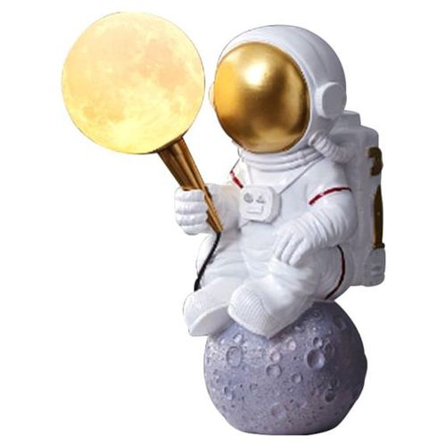 Lampara de mesa astronauta sobre la luna de resina