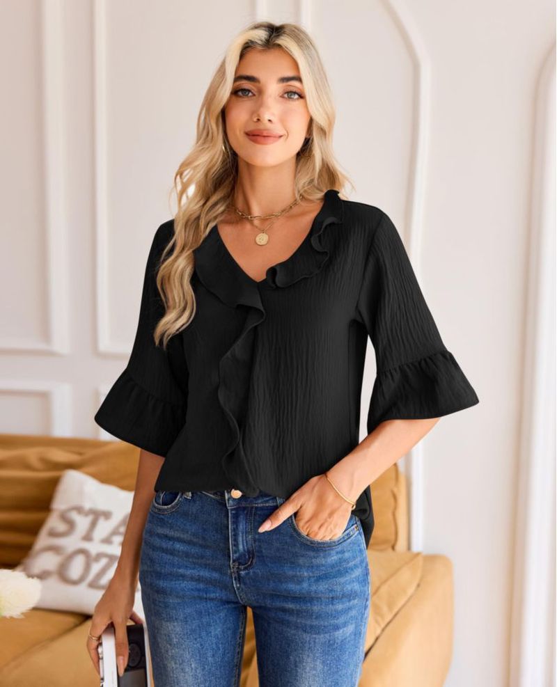 Blusa siliteelon de manga 3/4 con volantes color negro talla L