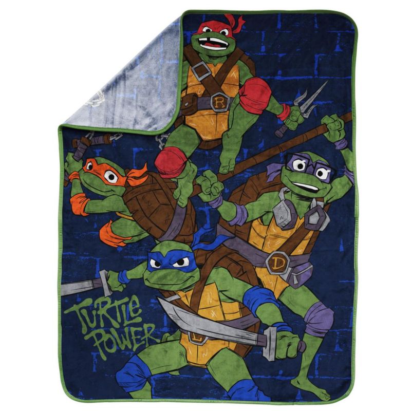 Manta decorativa Jay Franco 102 × 127 cm TMNT azul