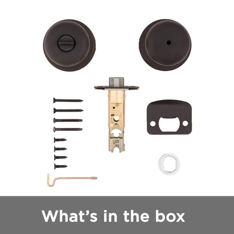 Pomo de puerta Kwikset Juno Interior Privacy con cerradura en bronce veneciano
