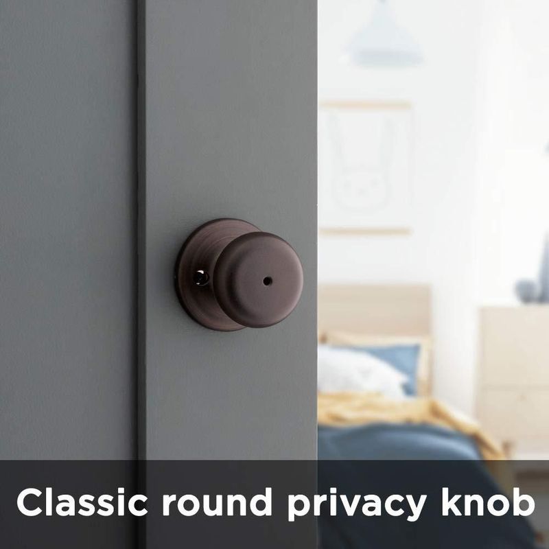 Pomo de puerta Kwikset Juno Interior Privacy con cerradura en bronce veneciano