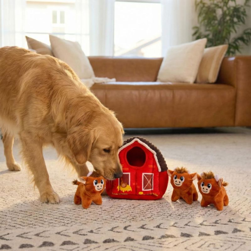 Juguete para perro Outward Hound Hide‑A‑Cow de peluche y rompecabezas
