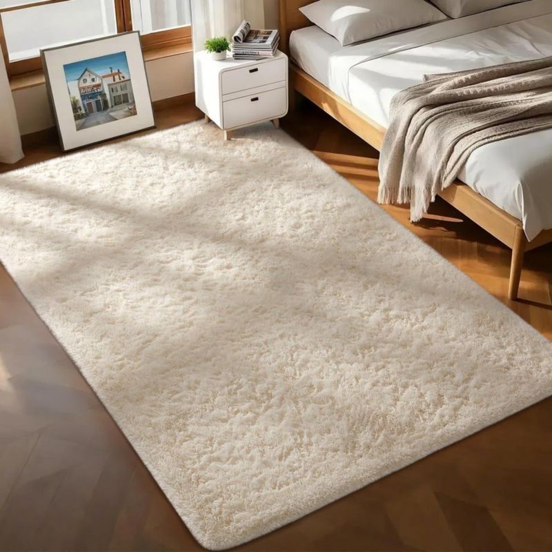 Alfombra de área Ophanie 183 x 274 cm marfil suave y antideslizante